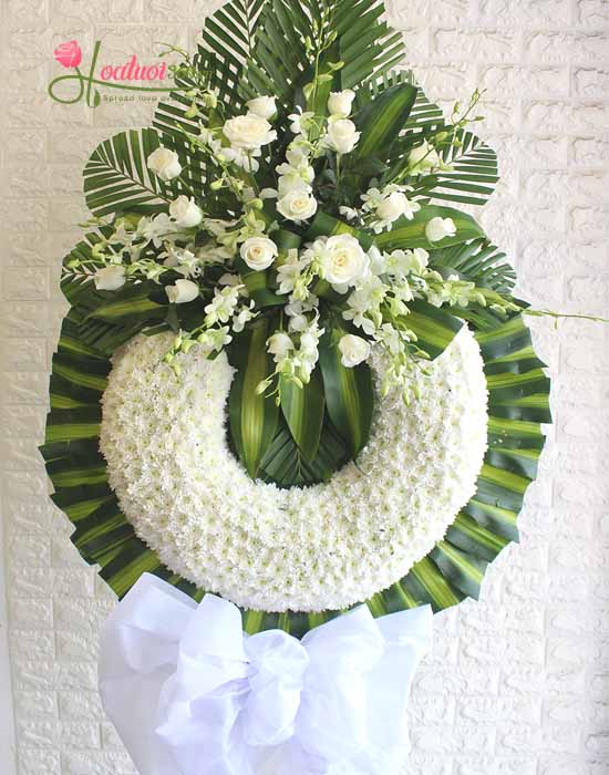 Condolence flower shelf with white chrysanthemums